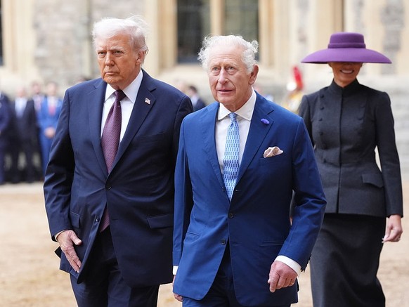 WINDSOR, ENGLAND - SEPTEMBER 17: US President Donald Trump and King Charles III followed by First Lady Melania Trump during the ceremonial welcome during the State visit by the President of the United ...