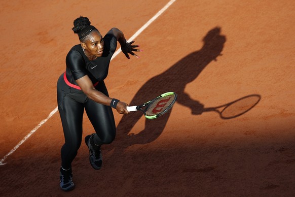 Serena Williams of the U.S. runs to return a shot against Germany's Julia Georges during their third round match of the French Open tennis tournament at the Roland Garros stadium in Paris, France ...