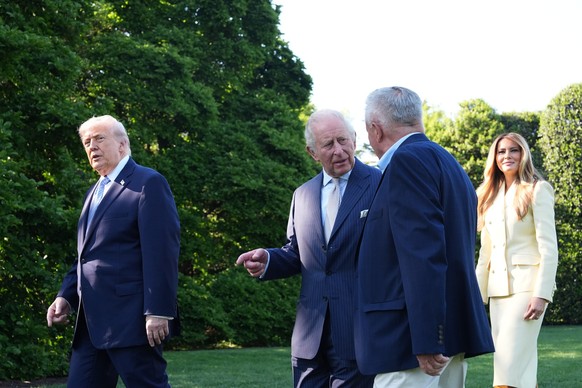 President Donald Trump and first lady Melania Trump arrive with Britain's King Charles III and Queen Camilla to look at the garden and bee hive on the South Lawn of the White House, Monday, April ...
