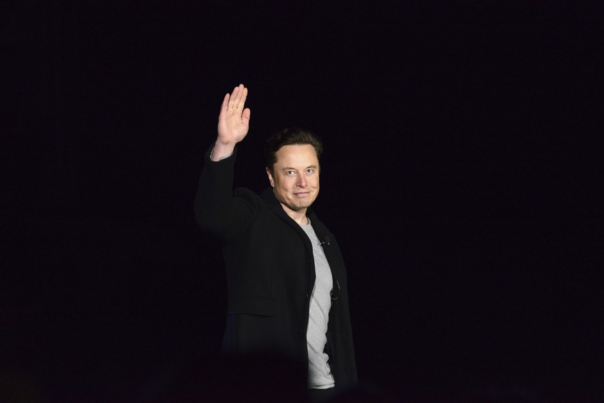 SpaceX&#039;s Elon Musk waves while providing an update on Starship, Thursday, Feb. 10, 2022, near Brownsville, Texas. Musk said that the first orbital flight of Starship--the world&#039;s most powerf ...