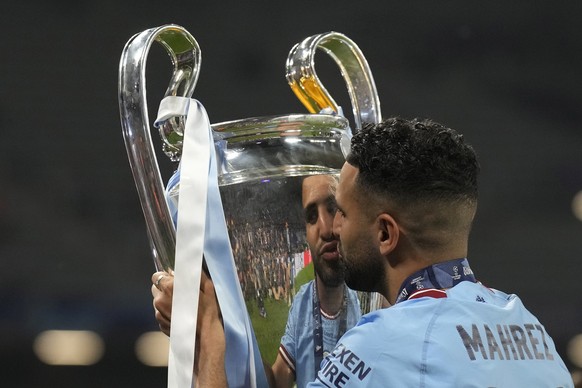 Manchester City&#039;s Riyad Mahrez celebrates with the trophy after winning the Champions League final soccer match between Manchester City and Inter Milan at the Ataturk Olympic Stadium in Istanbul, ...