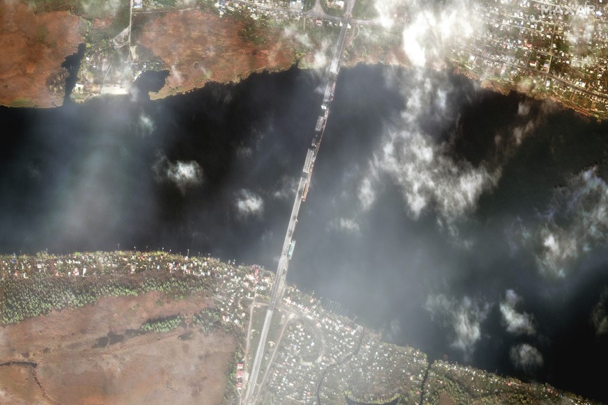 This satellite image released by Maxar Technologies shows the damaged Antonovskiy bridge, in Kherson, Ukraine, on Friday, Nov. 11, 2022. (Maxar Technologies via AP)
