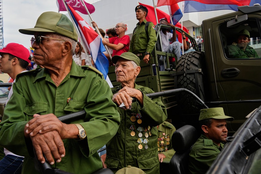 Veterans of the 1959 Cuban Revolution take part in a parade during the anniversary of Fidel Castro's arrival to the capital as the head of the rebel army, in Havana, Thursday, Jan. 8, 2026. (AP P ...