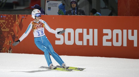 Switzerland's Bigna Windmueller lands her trial jump during the women's normal hill ski jumping final at the 2014 Winter Olympics, Tuesday, Feb. 11, 2014, in Krasnaya Polyana, Russia. (AP Ph ...