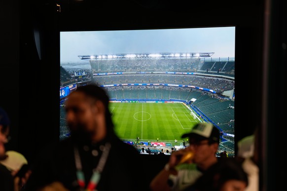 Fans gather in a sheltered area of the stadium during a thunderstorm warning in the World Cup Group I soccer match between France and Iraq in Philadelphia, Monday, June 22, 2026. (AP Photo/Matt Slocum ...