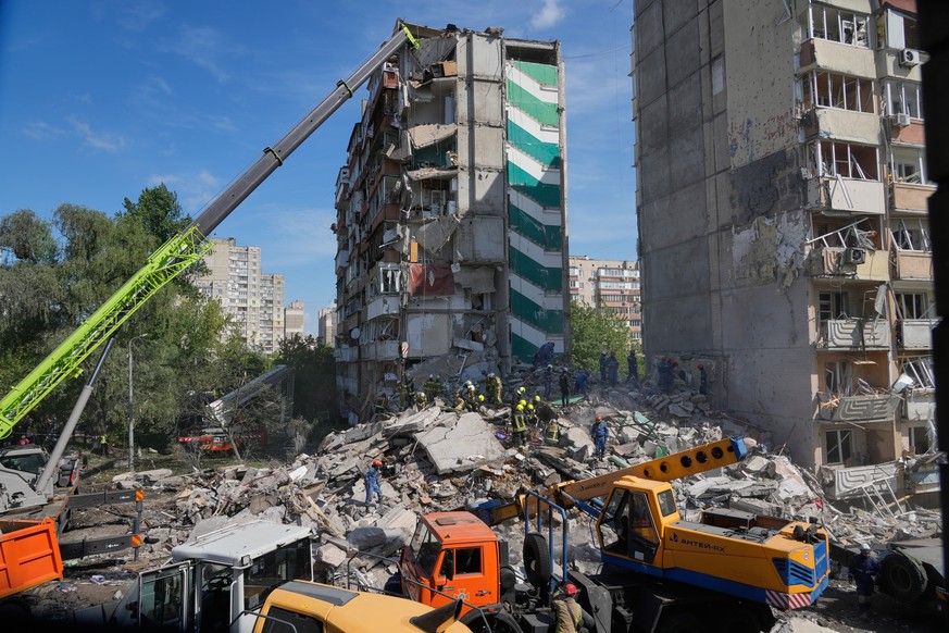 Rescuers clear the rubble after a Russian missile hit an apartment building during massive air attack in Kyiv, Ukraine, Thursday, May 14, 2026. (AP Photo/Efrem Lukatsky)
Russia Ukraine War