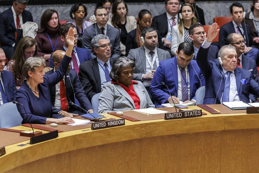 epaselect epa11242910 Ambassadors, except for United States Ambassador Linda Thomas-Greenfield (C), raise their hands to vote in favor of a resolution calling for an immediate ceasefire in Gaza, durin ...