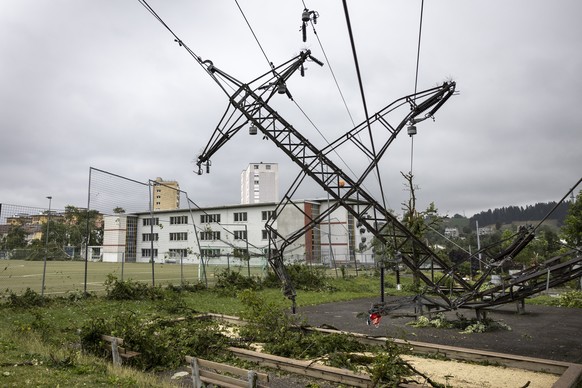 A high-voltage electricity pylon fell to the ground after tornado storm sweeps through the city of La Chaux-de-Fonds, Switzerland, Switzerland, Monday, July 24, 2023. A storm swept across part of the  ...