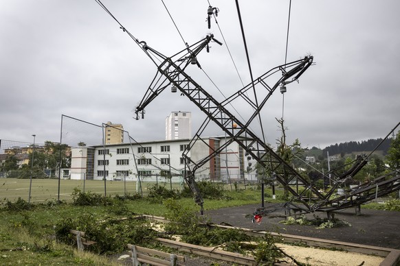 A high-voltage electricity pylon fell to the ground after tornado storm sweeps through the city of La Chaux-de-Fonds, Switzerland, Switzerland, Monday, July 24, 2023. A storm swept across part of the ...