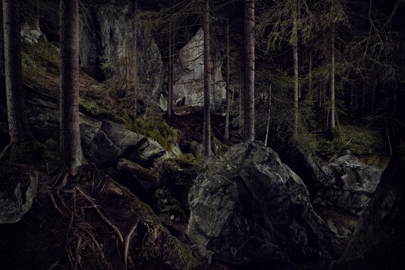 light painting in a forest with rocks