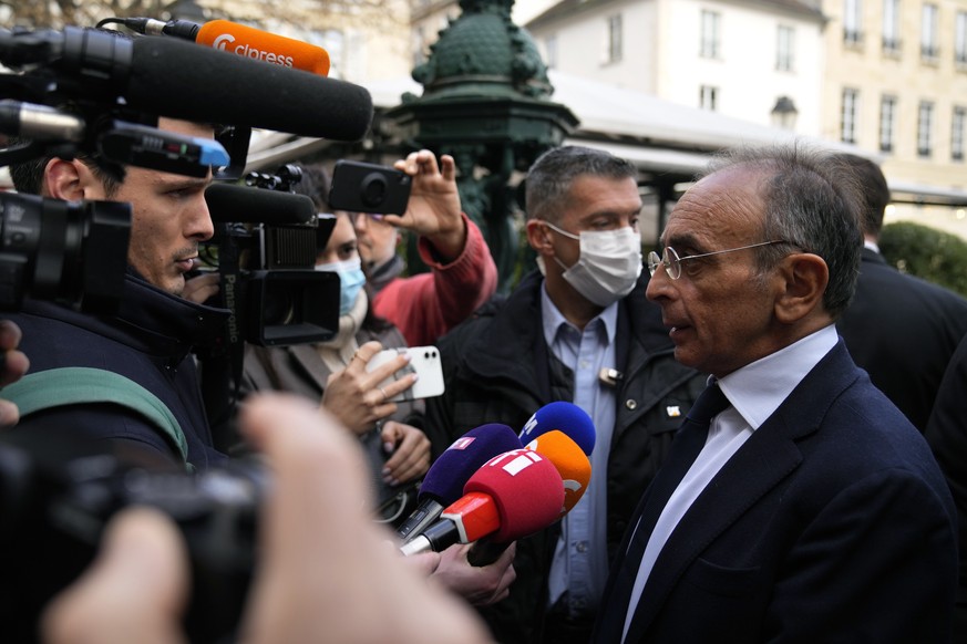 Far-right presidential candidate Eric Zemmour answers reporters prior to give a press conference at the Foreign Press Association headquarters, in Paris, Monday, Jan. 17, 2022. Zemmour was convicted M ...