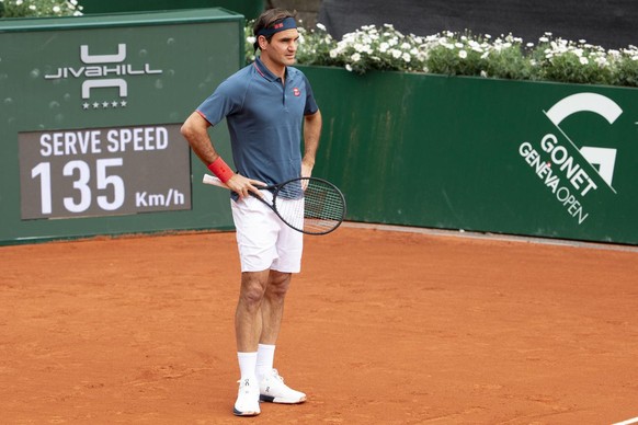 Roger Federer of Switzerland reacts after returning a ball to Pablo Andujar of Spain during their men&#039;s second round match, at the ATP 250 Geneva Open tournament in Geneva, Switzerland, Tuesday,  ...