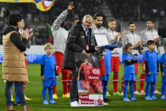 Switzerland's national soccer teams director Pierluigi Tami, left, and Ricardo Rodriguez pose on the occasion of his 100th game for the national team prior the UEFA Nations League group A2 soccer matc ...
