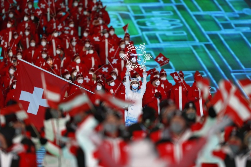 epa09727398 Athletes of Switzerland march during the Opening Ceremony for the Beijing 2022 Olympic Games at the National Stadium, also known as Bird&#039;s Nest, in Beijing China, 04 February 2022. EP ...