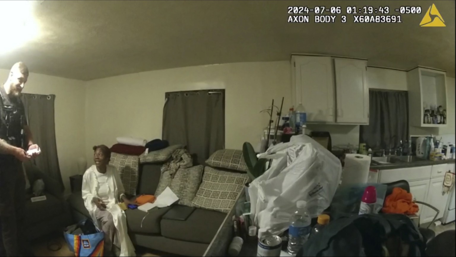 In this image taken from body camera video released by Illinois State Police, Sonya Massey, second from left, talks with former Sangamon County Sheriff?s Deputy Sean Grayson inside her home in Springf ...