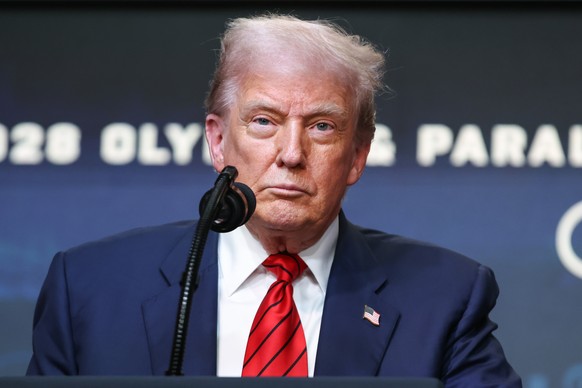 epa12285191 U.S. President Donald Trump takes questions after signing an executive order establishing a task force to oversee the Los Angeles 2028 Olympic Games in the South Court Auditorium of the Wh ...