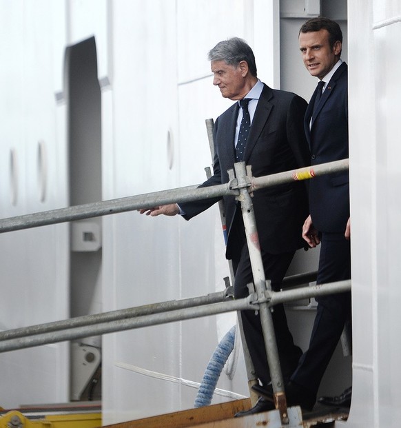 Chairman of MSC (Mediterranean Shipping Company) Gianluigi Aponte, left, and French President Emmanuel Macron visit of the MSC Meraviglia cruise ship during the delivery ceremony at the STX shipyard i ...