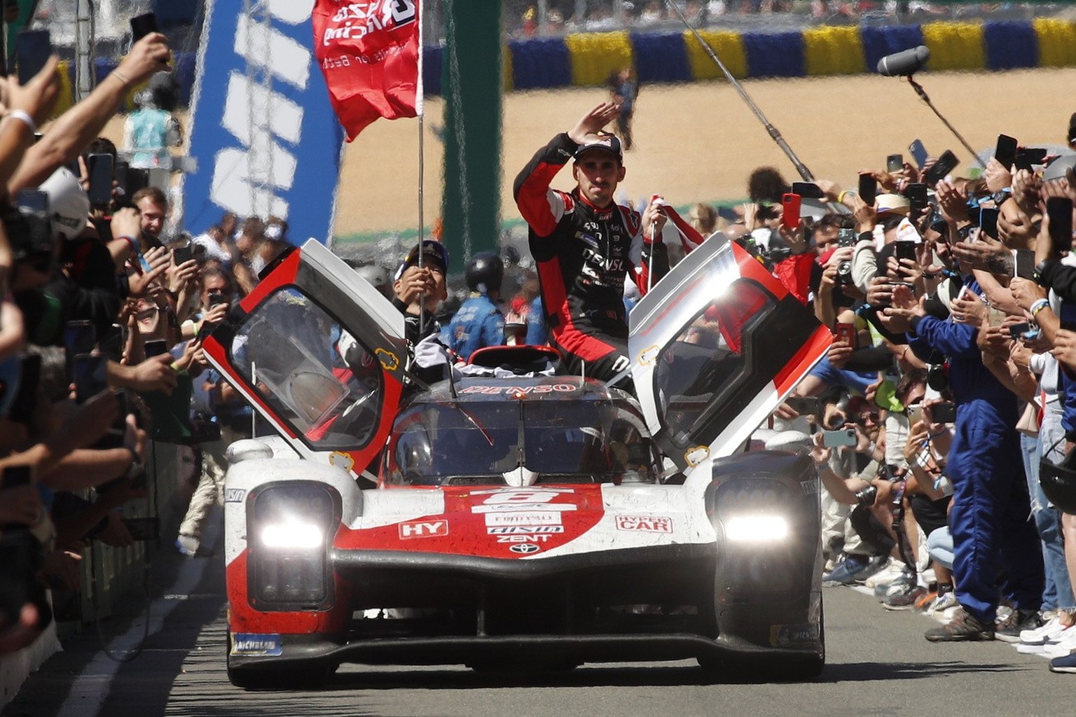 epa10009647 The Toyota Gazoo Racing team car (no.8), a Toyota GR010 Hybrid with Sebastien Buemi of Switzerland, Brendon Hartley of New Zealand, and Ryo Hirakawa of Japan enters the paddock after winni ...