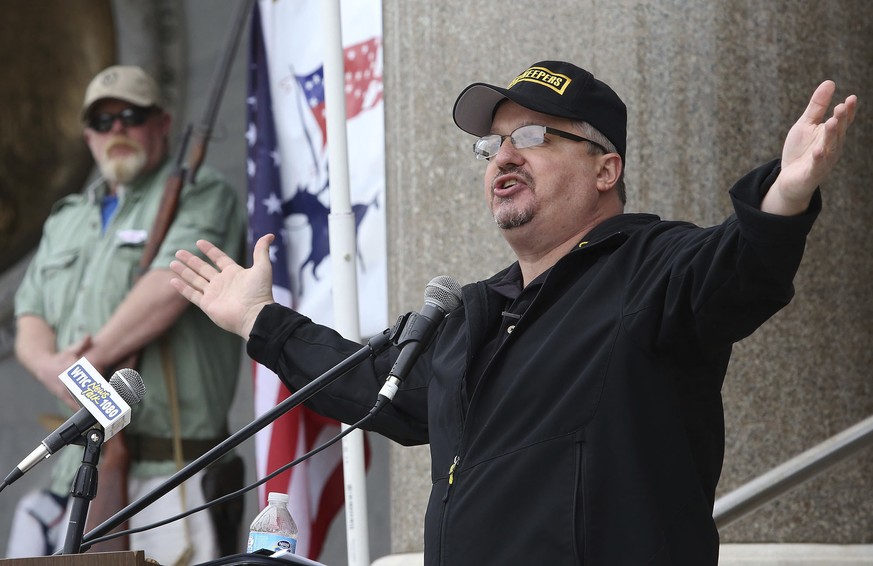 FILE - Stewart Rhodes, the founder of Oath Keepers, speaks during a gun rights rally at the Connecticut State Capitol in Hartford, Conn., April 20, 2013. Rhodes has been sentenced to 18 years in priso ...