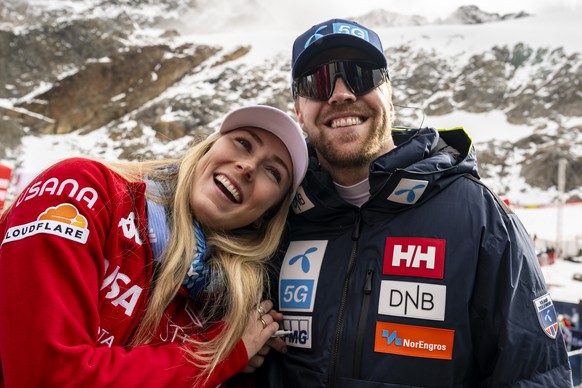 Mikaela Shiffrin of the United States, left, and Aleksander Aamodt Kilde of Norway, right, react after the second run of the Women&#039;s Giant Slalom race of the FIS Alpine Skiing World Cup season op ...