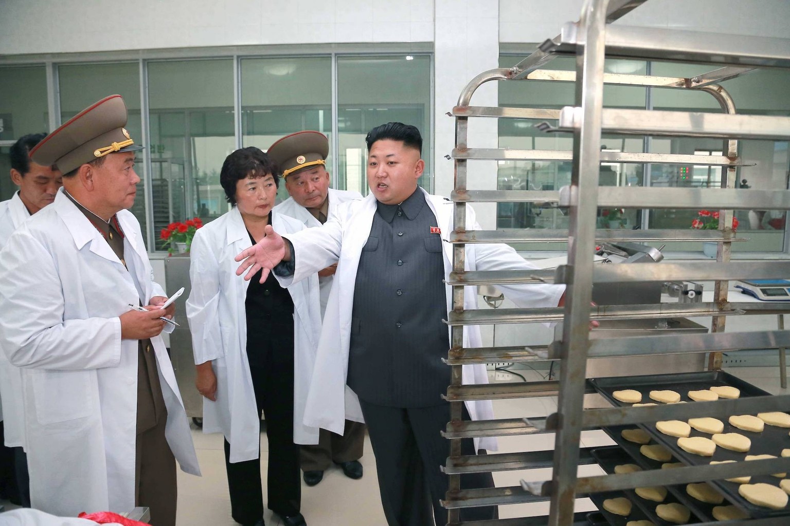 PYONGYANG, Aug. 24, 2014 -- Photo provided by Korean Central News Agency () on Aug. 24, 2014 shows top leader of the Democratic People s Republic of Korea (DPRK) Kim Jong Un (1st, right) inspects the  ...