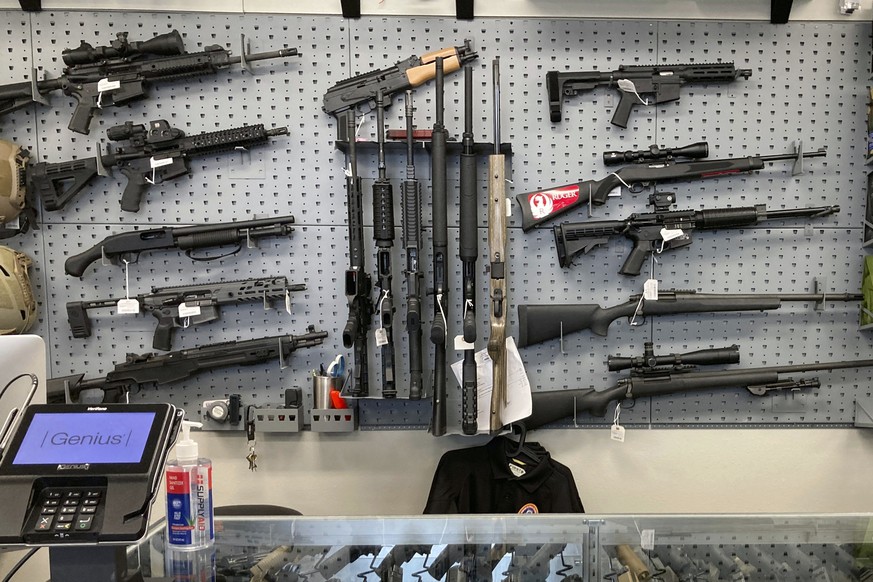FILE - In this Feb. 19, 2021, file photo, firearms are displayed at a gun shop in Salem, Ore. The first legal test of whether a wave of U.S. counties can legally declare themselves &quot;Second Amendm ...
