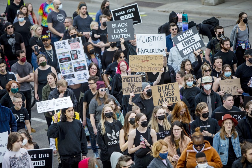 Activists rally for Patrick Lyoya in Grand Rapids, Mich., on Tuesday, April 12, 2022. Grand Rapids Police Chief Eric Winstrom said Lyoya, 26, was shot after a struggle with an officer following a traf ...