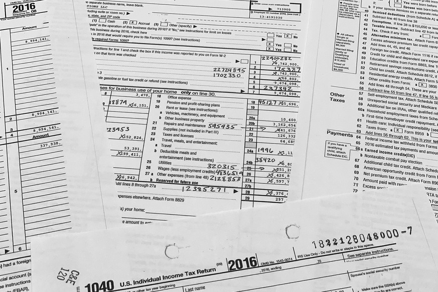 Copies of former President Donald Trump and former first lady Melania Trump individual tax returns for the year 2016, released by the Democratic-controlled House Ways and Means Committee, are photogra ...