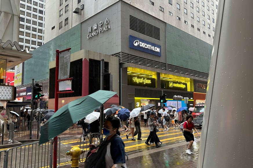 Passersby walk in Hong Kong's Mong Kok district under heavy rain and wind ahead of Typhoon Noul on Saturday, July 25, 2026. (AP Photo/Chan Ho-him)
Asia Storm