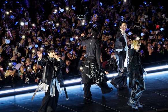 Kpop group BTS waves at the end of their 'BTS The Comeback Live Arirang' concert in central Seoul, South Korea, March 21, 2026. (Kim Hong-Ji/Pool Photo via AP)
Kpop sensation BTS holds free  ...