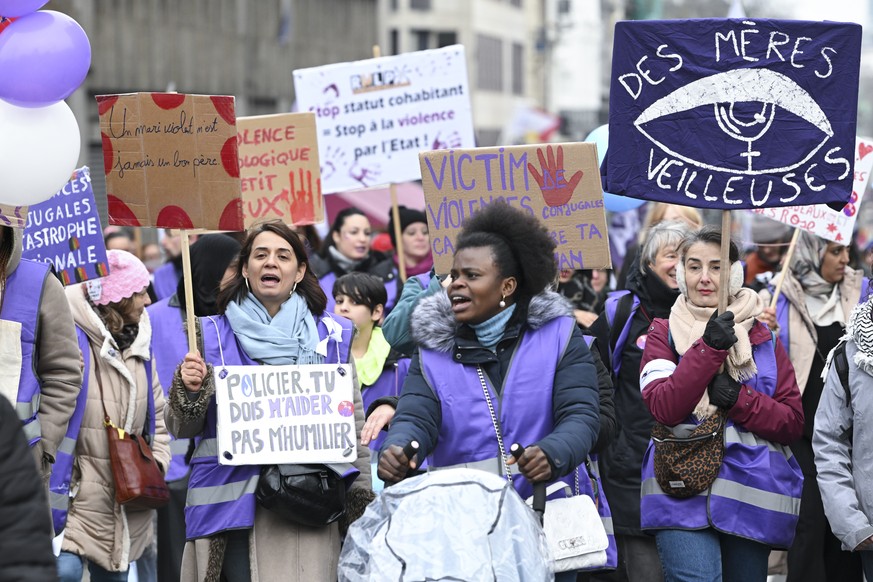 epa10996485 People take part in a rally against violence against women marking the International Day for the Elimination of Violence Against Women in the city center of Brussels, Belgium, 26 March 202 ...