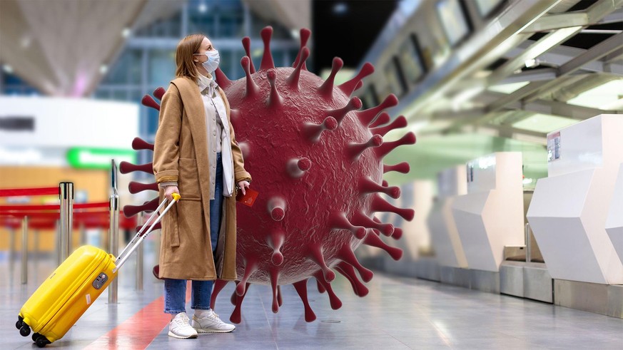 Woman with luggage stands at almost empty check-in counters at the airport terminal due to coronavirus pandemicCovid-19 outbreak travel restrictions. Flight cancellation.Quarantine all over the world