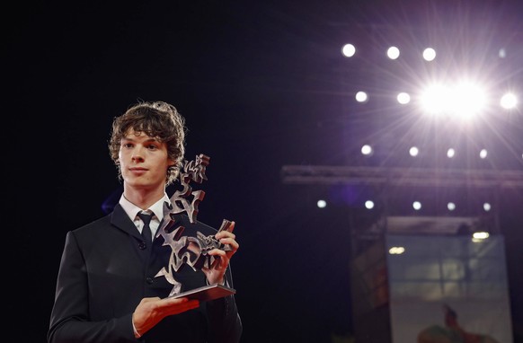 epa11592261 French actor Paul Kircher holds the Marcello Mastroianni Award for Best New Young Actor for his performance in the movie &#039;Leurs enfants apres eux&#039; (And their children after them) ...
