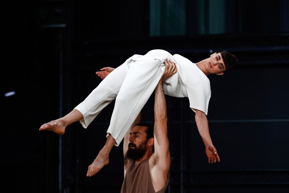 epa10029506 Models present creations from the Spring / Summer 2023 Men&#039;s collection by Japanese designer Issey Miyake during Paris Fashion Week, in Paris, France, 23 June 2022. The presentation o ...