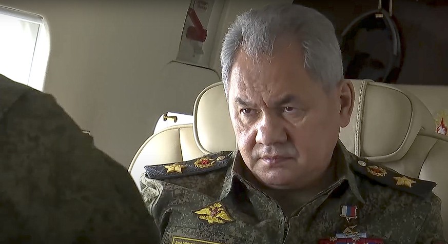 In this photo taken from video provided by the Russian Defense Ministry Press Service on Wednesday, Feb. 16, 2022, Russian Russian Defense Minister Sergei Shoigu , left, speaks to hight rang officers  ...