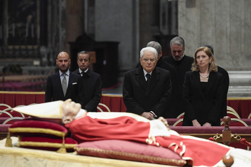 epa10386144 A handout photo made available by Vatican Media shows Italian President Sergio Mattarella paying respects to Pope Emeritus Benedict XVI (Joseph Ratzinger) whose body lies in state in Saint ...