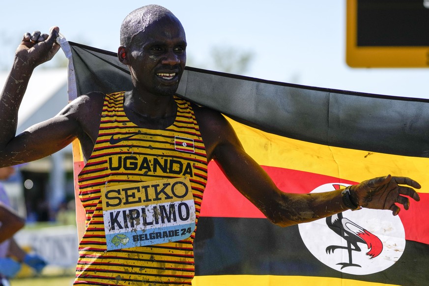 Jacob Kiplimo of Uganda celebrates as he won the men's senior race during the World Athletics Cross Country Championships in Belgrade, Serbia, Saturday, March 30, 2024. (AP Photo/Darko Vojinovic)