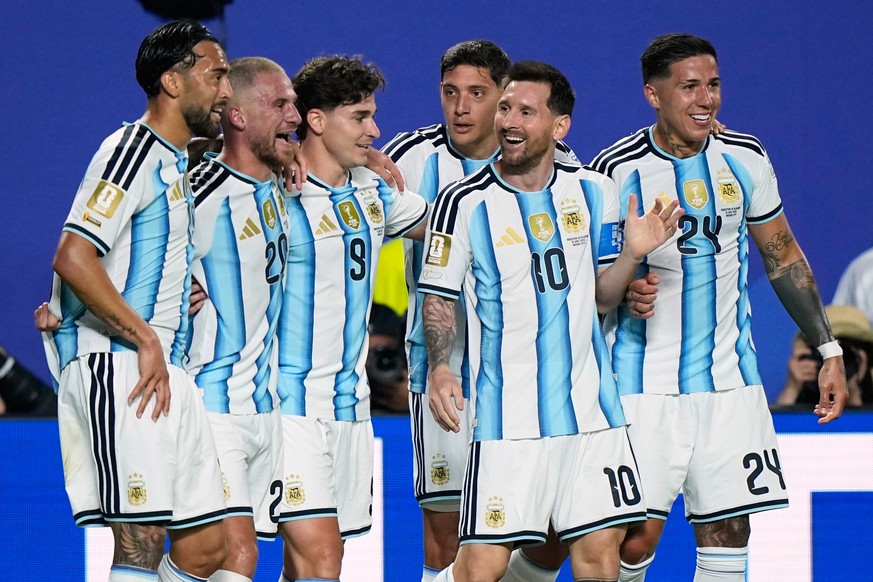 Argentina's Lionel Messi, second right, celebrates with teammates after scoring his team's second goal during the World Cup Group J soccer match between Argentina and Algeria in Kansas City, ...