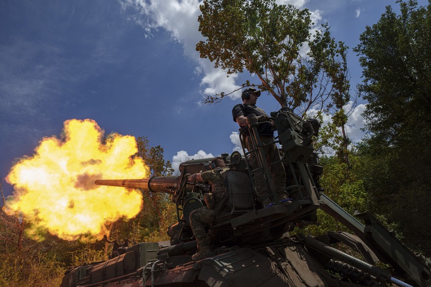 Ukrainian soldiers, of 43rd artillery brigade, fire by 2s7 self-propelled howitzer towards Russian positions at the frontline in Donetsk region, Ukraine, Monday, June 24, 2024. (AP Photo/Evgeniy Malol ...