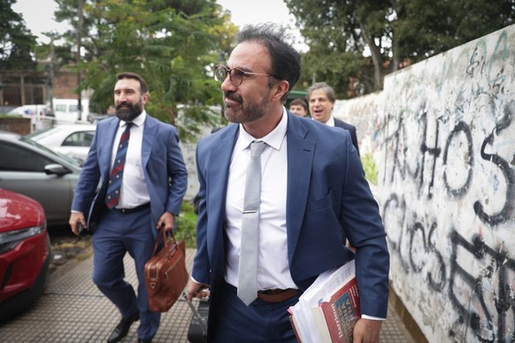 Argentine football legend Diego Maradona's former doctor Leopoldo Luque arrives at a courthouse to testify during a hearing in the trial over Maradona's death in San Isidro, on the outskirts ...