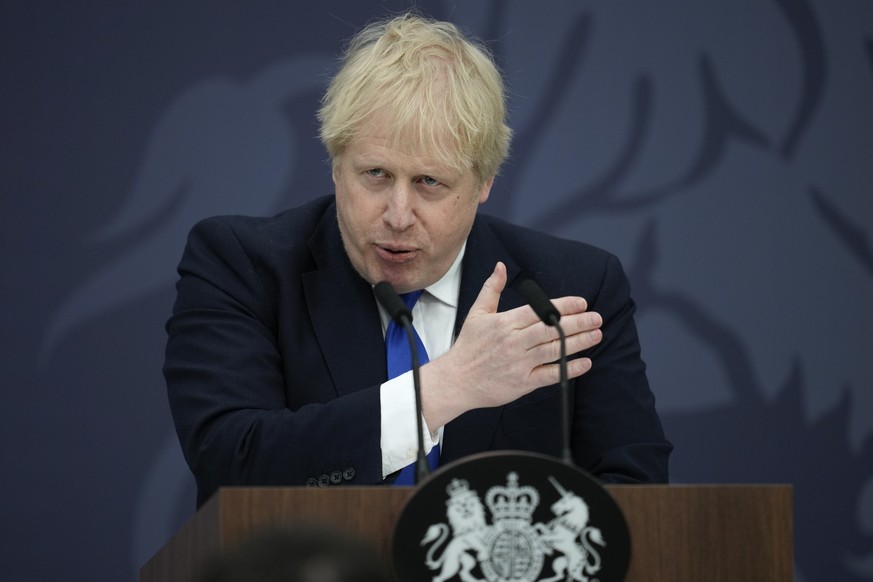British Prime Minister Boris Johnson delivers a speech at Lydd Airport, south east England, Thursday, April 14, 2022. Britain says it has struck a deal with Rwanda to send some asylum-seekers to the c ...