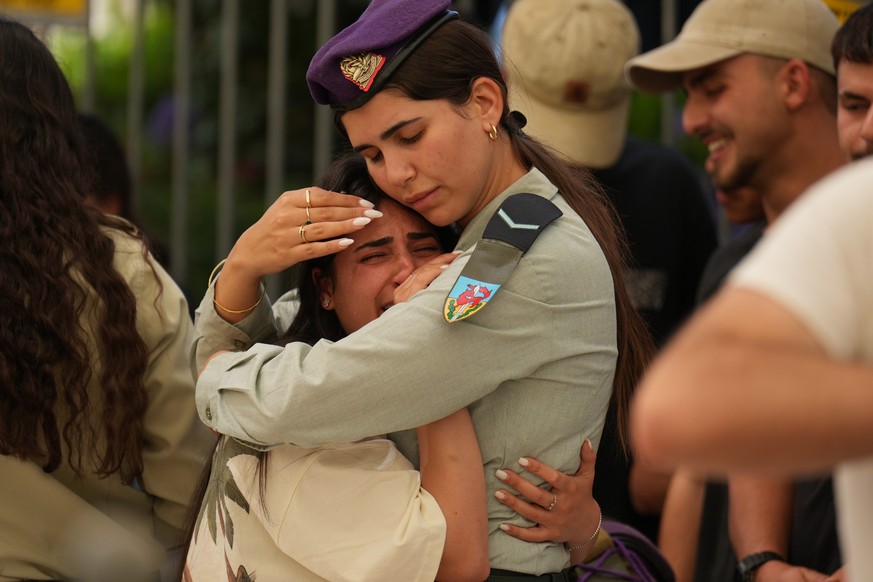 KEYPIX - Friends mourn during the funeral of the Israeli soldier Sgt. Rotem Yanai, who was killed in a Lebanese drone attack on northern Israel, in Givat Ada, Israel, Thursday, May 28, 2026. (AP Photo ...
