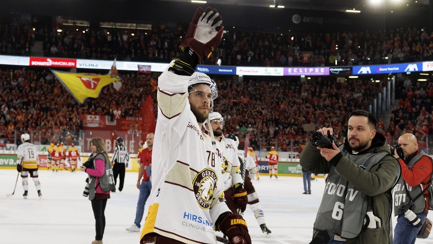 Geneve-Servette&#039;s forward Marc-Antoine Pouliot greats his supporters after defeating the team Biel-Bielle, during the fourth leg of the National League Swiss Championship final playoff game betwe ...