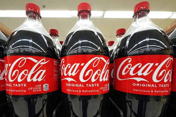 Bottles of Coca-Cola are on display at a grocery market in Uniontown, Pa, on Sunday, April 24, 2022. Coca-Cola Co. on Monday, April 25, 2022, reported first-quarter net income of $2.78 billion. The At ...
