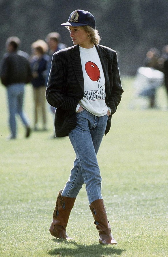 WINDSOR, UNITED KINGDOM - MAY 02: Diana, Princess Of Wales At Guards Polo Club. The Princess Is Casually Dressed In A Sweatshirt With The British Lung Foundation Logo On The Front, Jeans, Boots And A  ...