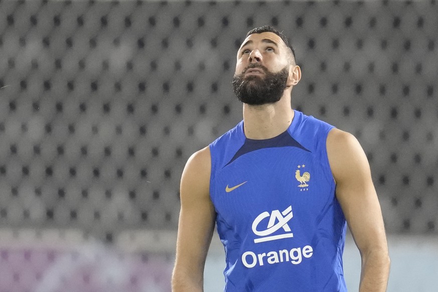 France&#039;s Karim Benzema watches the ball during a training session at the Jassim Bin Hamad stadium in Doha, Qatar, Saturday, Nov. 19, 2022. France will play their first match in the World Cup agai ...