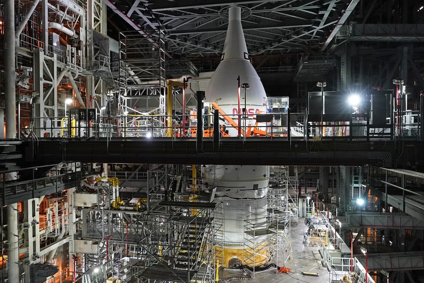 FILE - A section of the Artemis rocket with the Orion space capsule is seen inside the Vehicle Assembly Building at the Kennedy Space Center, Friday, Nov. 5, 2021, in Cape Canaveral, Fla. The Orion ca ...