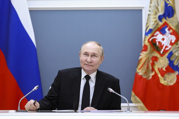 Russian President Vladimir Putin attends a meeting with large families from various Russia&#039;s regions via videoconference at the Kremlin in Moscow, Russia, Thursday, May 30, 2024. (Alexander Kazak ...