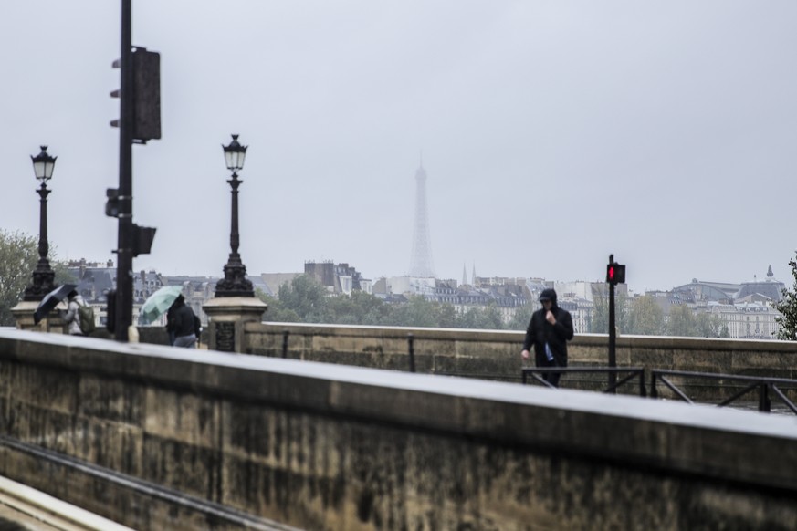 epa11650953 A fog covers the Eiffel Tower in Paris, France, 09 October 2024. Storm Kirk has caused major disruptions in France&#039;s southwest, resulting in high winds and flooding. In Paris, a month ...
