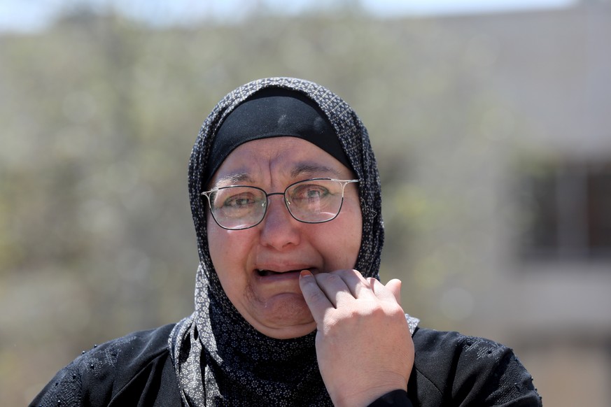 epa10785601 A Palestinian relative mourns during a funeral of Qusai Metan at Burqa village near the city of Ramallah, West Bank, 05 Auguat 2023. According to the Palestinian Health Ministry, one Pales ...